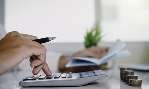 Man using a calculator